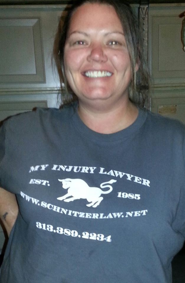 Smiling person wearing a lawyer-themed T-shirt.
