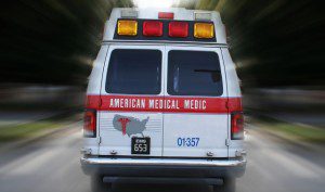 Ambulance with red and yellow lights.