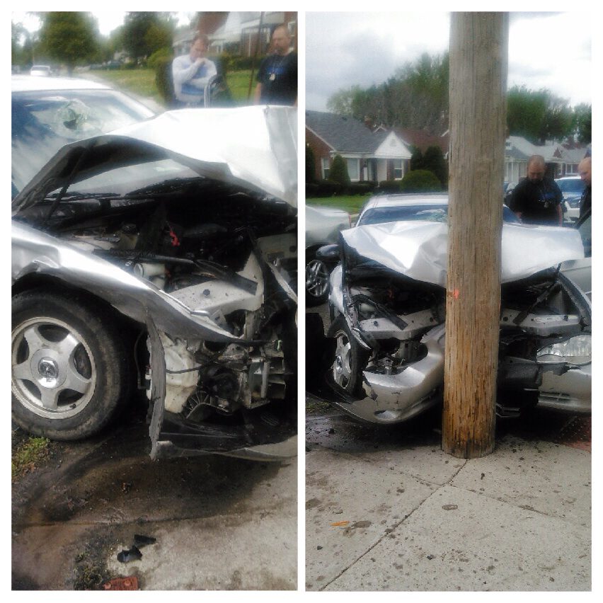 Car crashed into utility pole, damaged front.