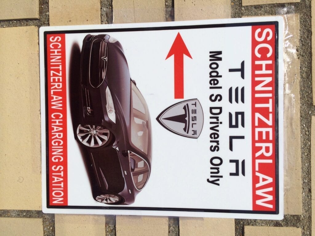 Tesla Model S charging station sign.