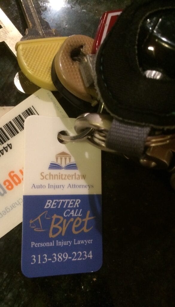 Keychain with personal injury lawyer tag.