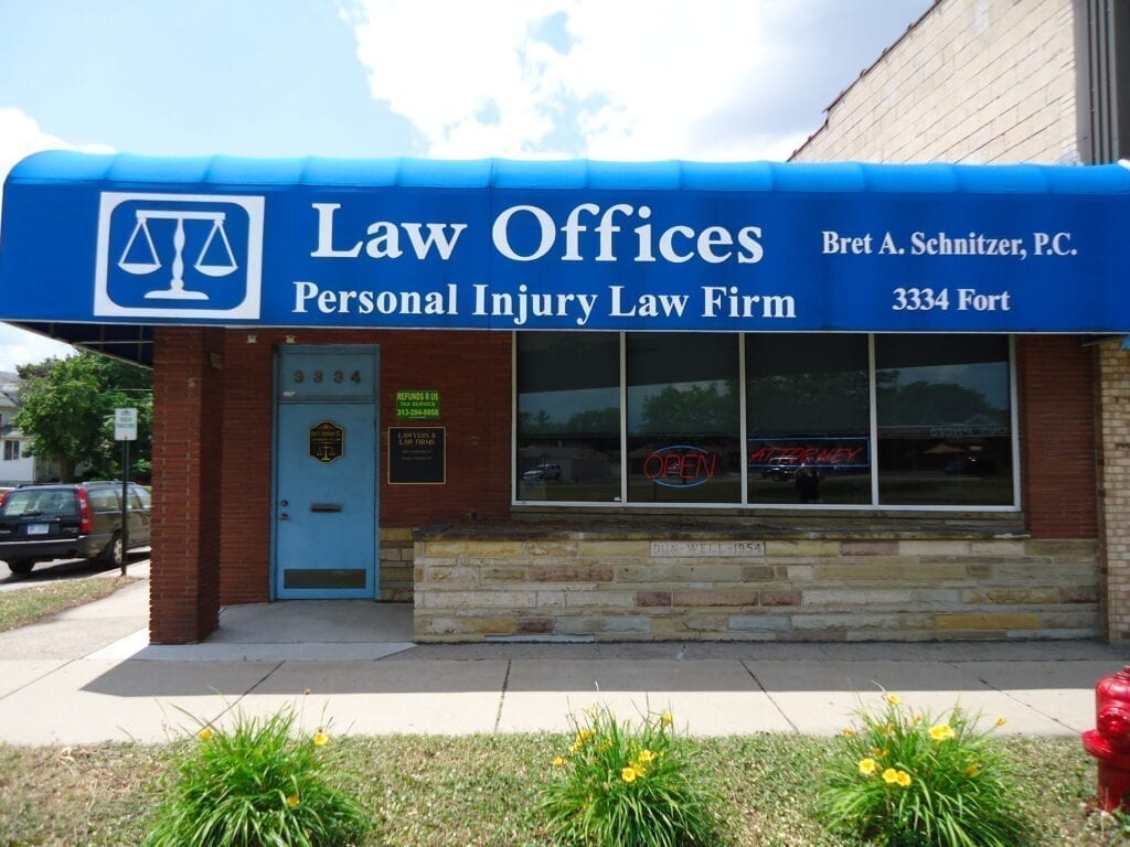 Blue awning of personal injury law firm.